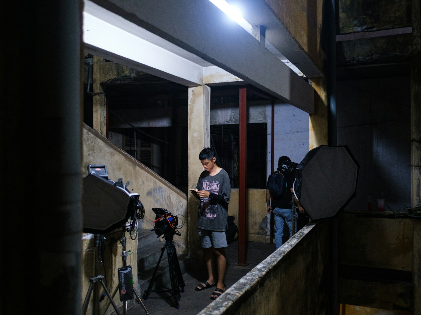 Reference image of filmmakers, cinema camera and large softbox lights